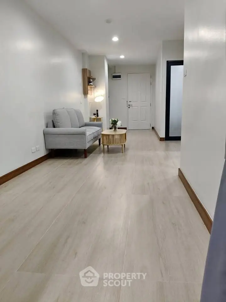 Spacious modern living room with minimalist decor and elegant flooring