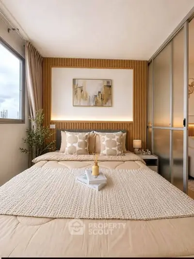 Modern bedroom with stylish decor and large window for natural light