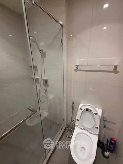 Modern bathroom with glass shower and sleek toilet design