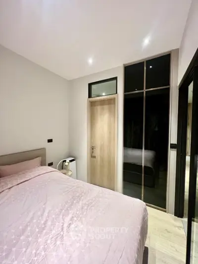 Modern bedroom with sleek design and ample storage space