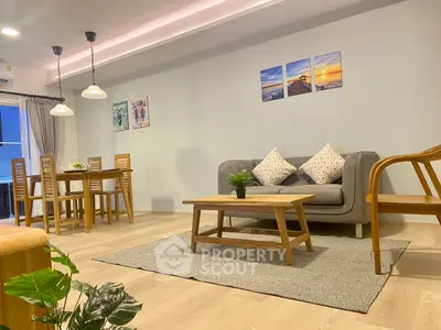 Spacious modern living room with stylish decor and dining area, perfect for entertaining.