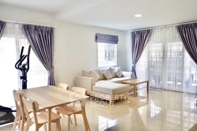 Spacious living room with modern decor and natural light