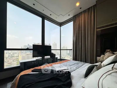Luxurious bedroom with panoramic city view from floor-to-ceiling windows, featuring modern decor and cozy ambiance.