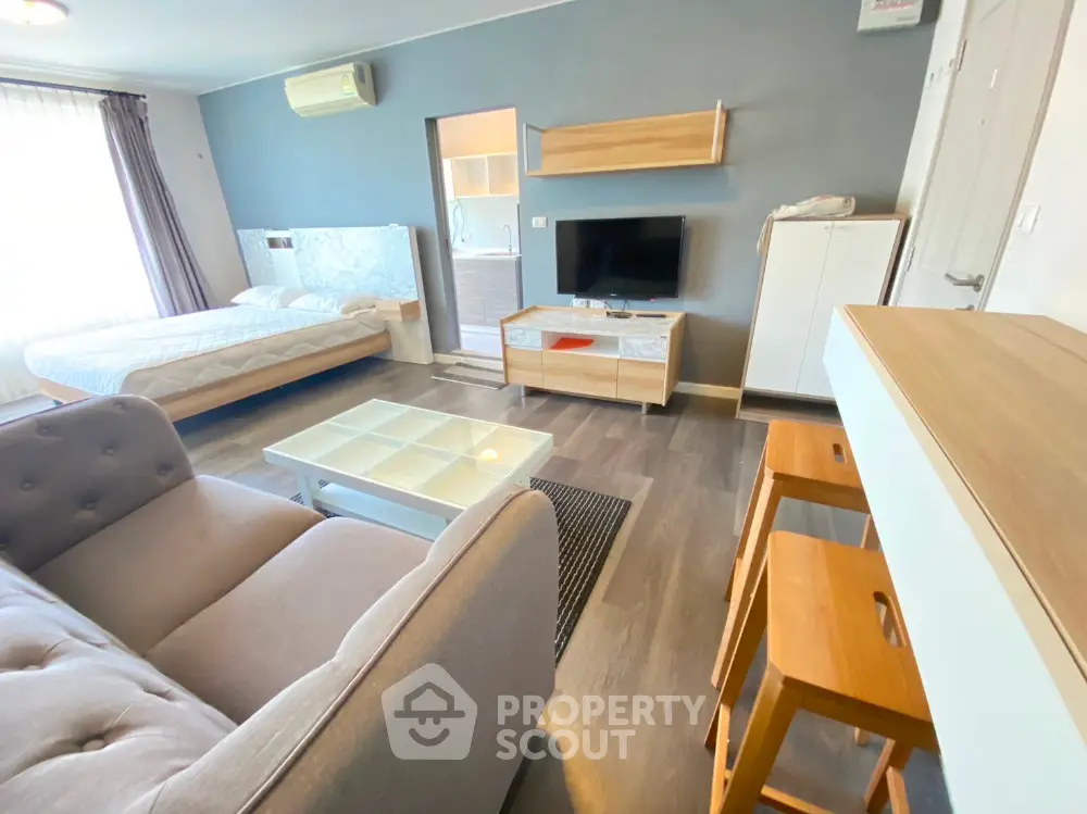 Modern studio apartment with stylish furniture and open layout