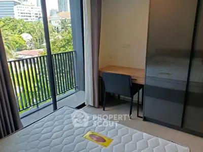 Modern bedroom with balcony view in urban apartment