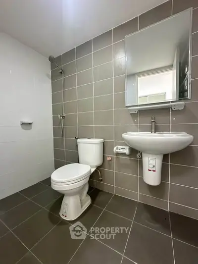 Modern bathroom with sleek fixtures and neutral tile design