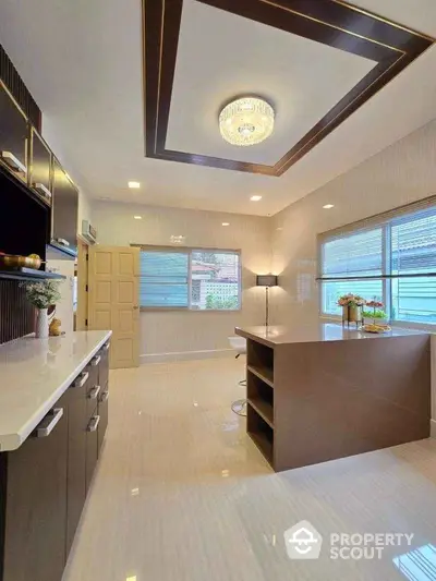 Luxurious modern kitchen with island and elegant lighting