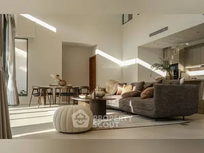Luxurious modern living room with elegant furniture and abundant natural light
