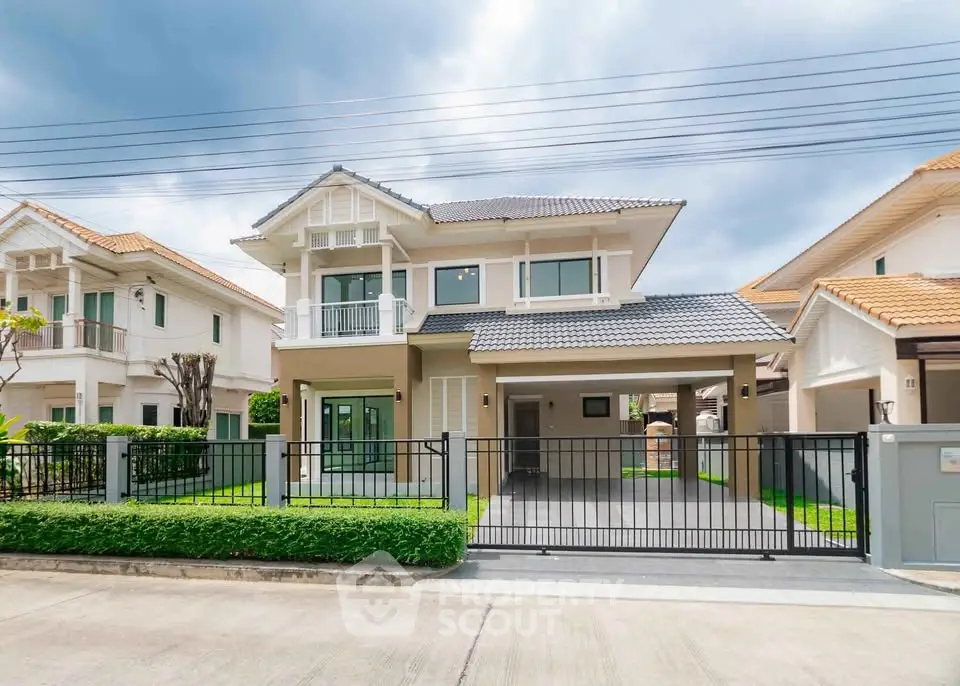 Stunning modern two-story house with spacious driveway and lush green lawn in a serene neighborhood.