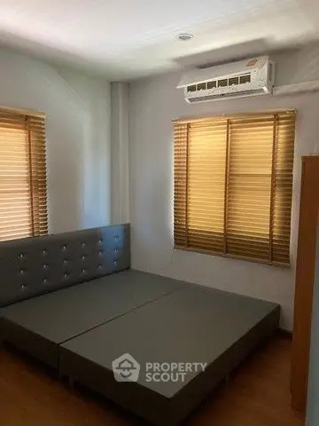 Cozy bedroom with modern air conditioning and stylish blinds