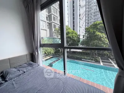 Luxurious bedroom with pool view in modern high-rise apartment