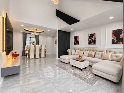Luxurious living room with elegant decor and spacious dining area, perfect for modern living.