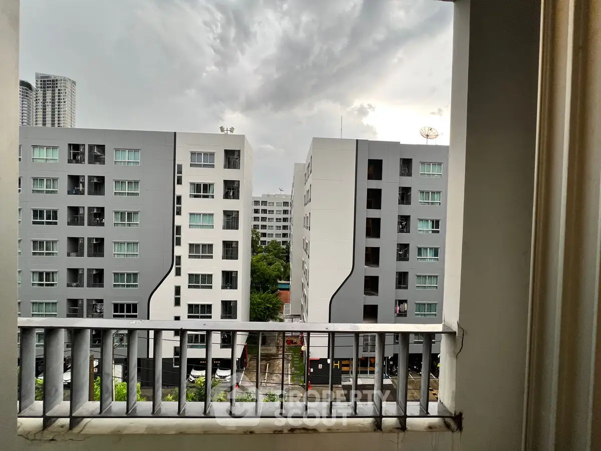 Modern urban apartment view from balcony with overcast sky