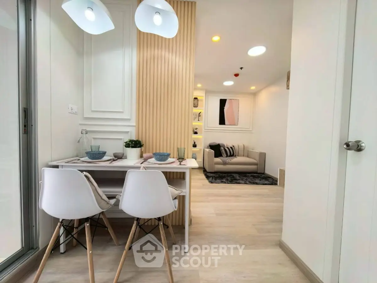 Modern open-plan living and dining area with stylish decor and natural light.