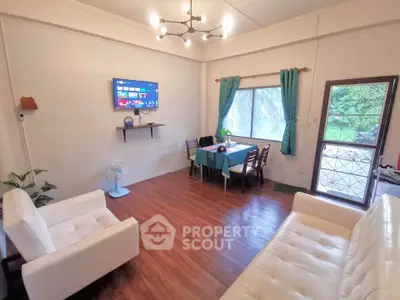 Charming living room with modern decor and large window view
