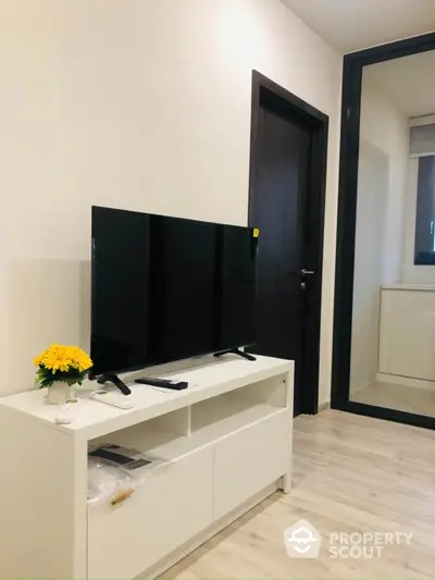 Modern living room with sleek TV stand and minimalist decor