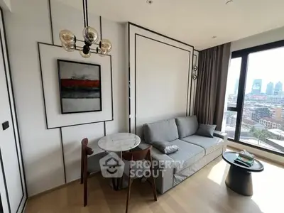 Modern living room with stylish decor and city view, featuring a cozy sofa and elegant lighting.