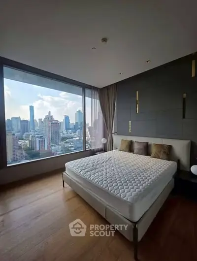 Luxurious bedroom with stunning city skyline view and modern decor