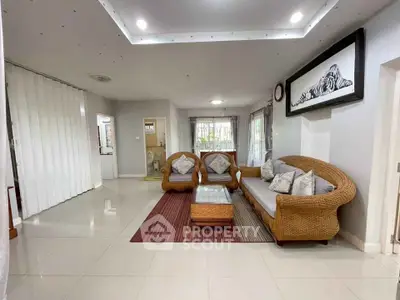 Spacious living room with elegant wicker furniture and modern decor