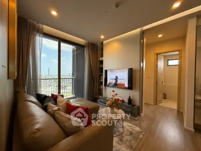 Modern living room with city view and cozy decor in high-rise apartment