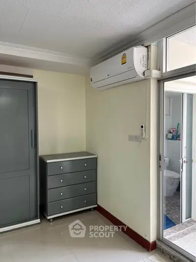 Cozy bedroom corner with air conditioning and modern furniture