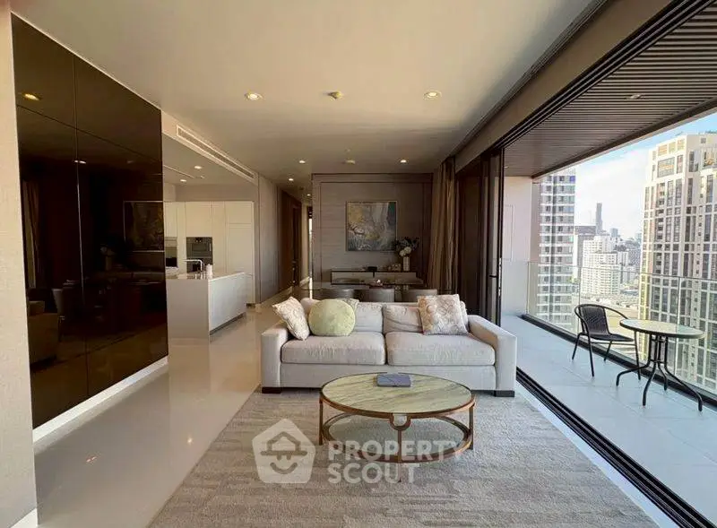 Luxurious modern living room with expansive city view and spacious balcony in high-rise apartment.