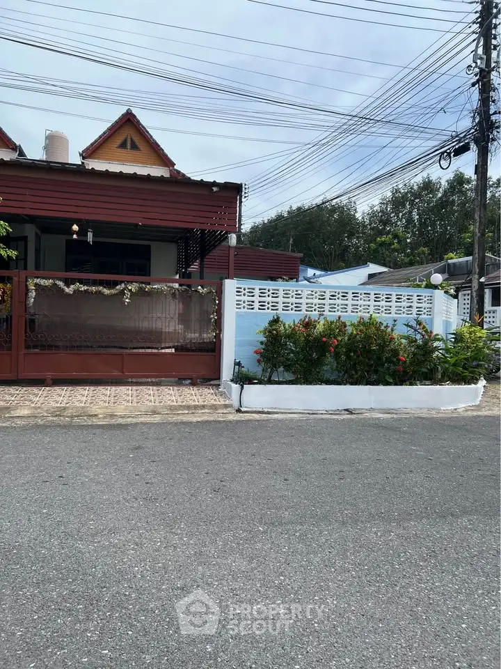 Charming suburban house with decorative facade and lush garden in a peaceful neighborhood.