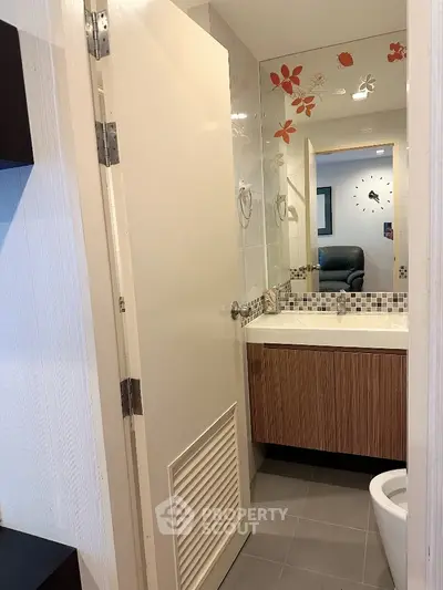 Modern bathroom with stylish vanity and decorative wall tiles