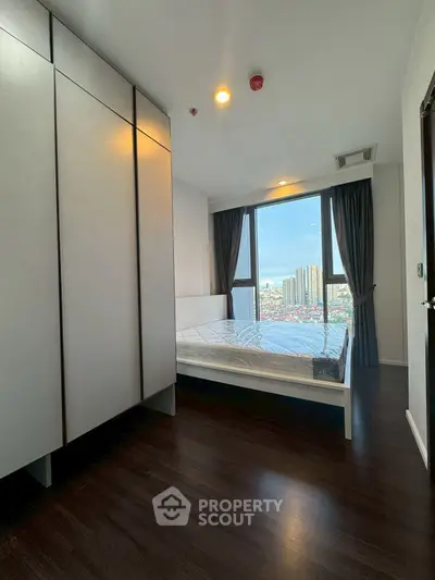 Modern bedroom with city view and sleek design
