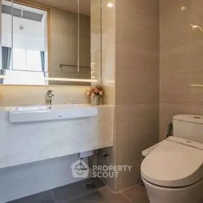 Modern bathroom with sleek fixtures and elegant lighting