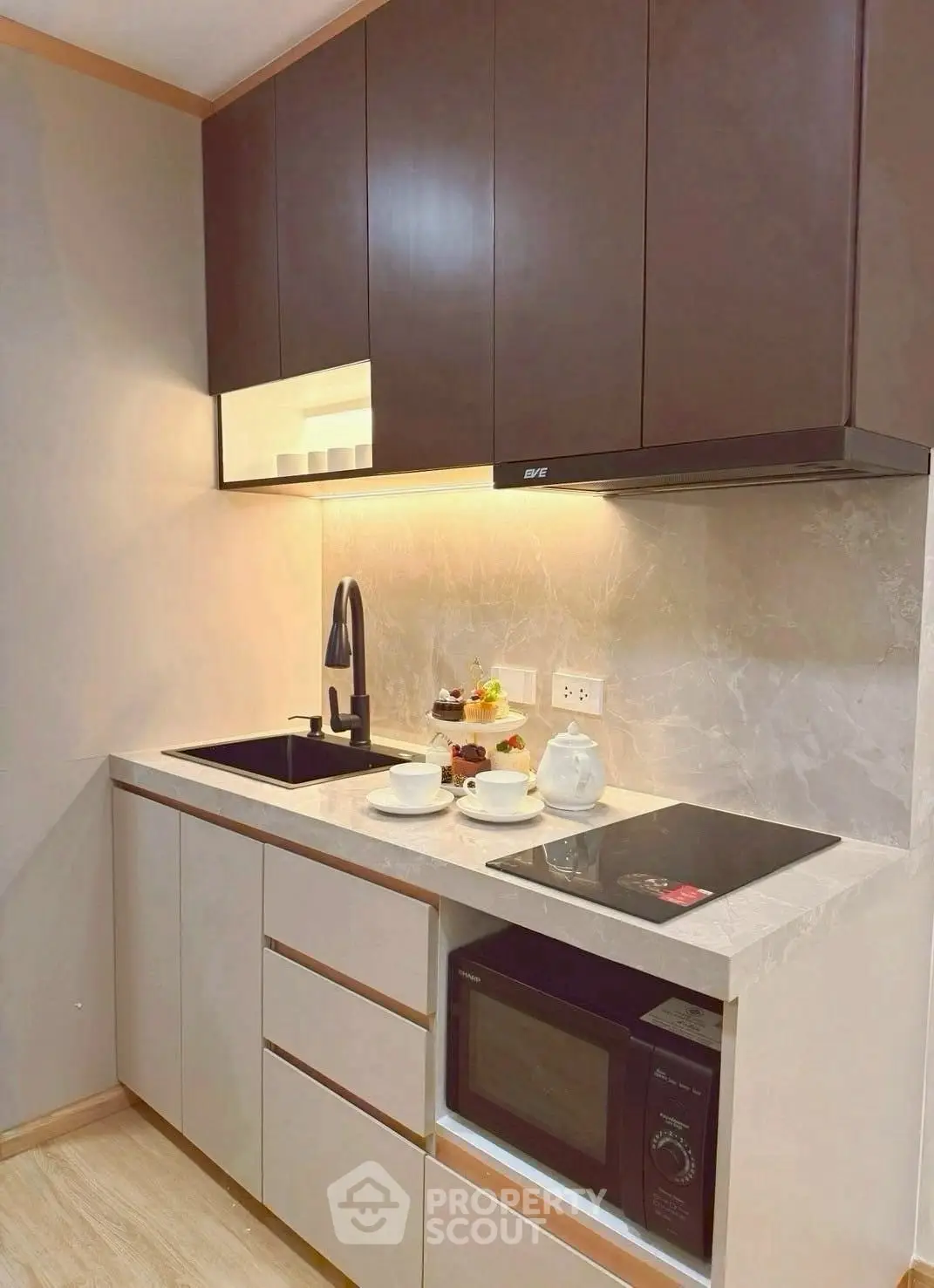 Modern kitchen with sleek cabinets and built-in appliances