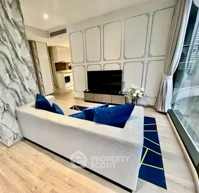 Modern living room with stylish decor and open kitchen layout