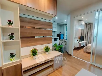 Modern apartment interior with open layout, featuring stylish living room and cozy bedroom.