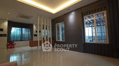 Spacious modern living room with large windows and sleek design
