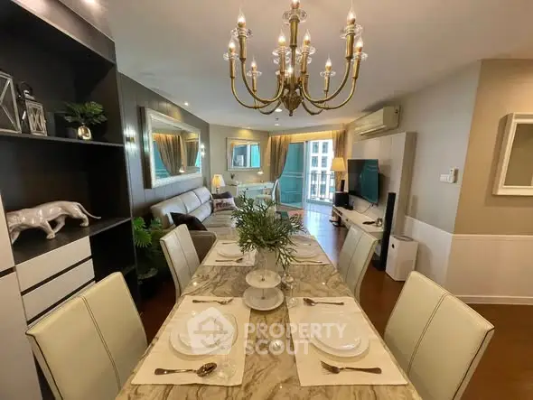 Elegant dining area with marble table and chandelier in modern living room
