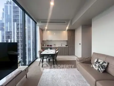 Modern living room with open kitchen and city view in luxury apartment