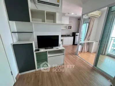 Modern apartment interior with open layout, featuring a cozy living area and sleek kitchen design.