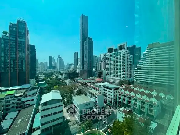 Stunning cityscape view from a high-rise building, showcasing urban skyline and modern architecture.