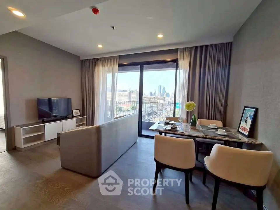 Modern living room with city view, stylish furniture, and dining area in a high-rise apartment.