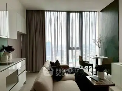 Modern living room with floor-to-ceiling windows and city view, featuring sleek furniture and elegant decor.