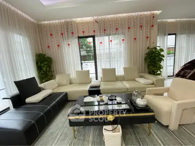 Luxurious modern living room with elegant decor and ample natural light