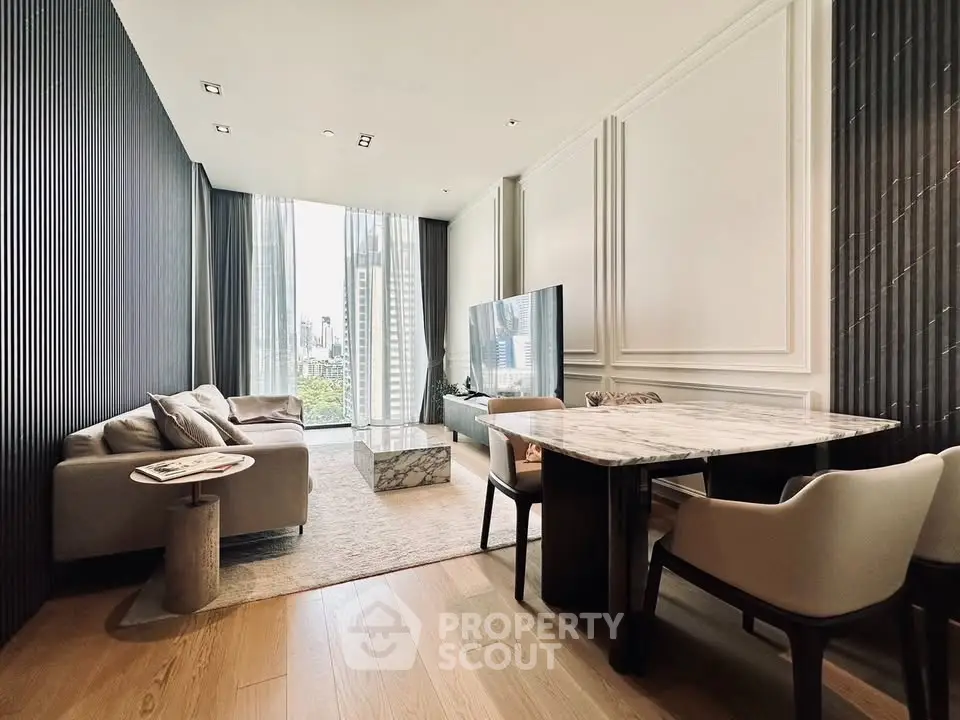 Luxurious modern living room with elegant decor and city view, featuring a marble dining table and plush seating.
