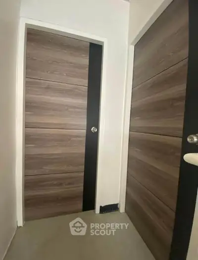 Modern interior doors with sleek wood finish in a contemporary home setting.