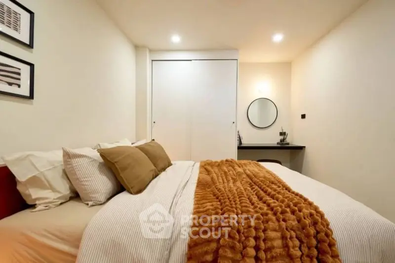 Cozy bedroom with warm lighting and stylish decor