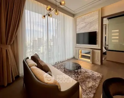 Luxurious living room with modern decor, large windows, and elegant lighting in a high-rise apartment.