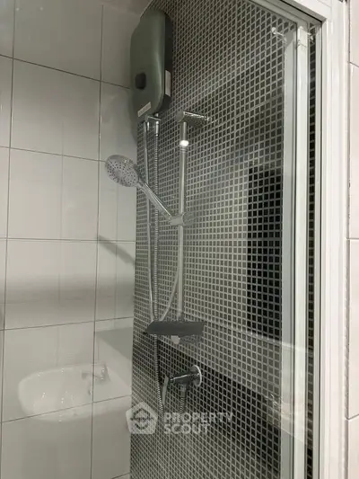 Modern bathroom with sleek shower and stylish tile design, perfect for a contemporary home.