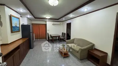 Spacious living room with modern furniture and open layout, perfect for relaxation and entertainment.