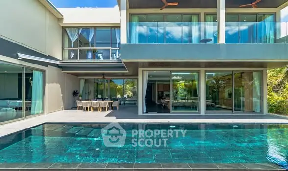 Luxurious modern villa with stunning pool and spacious outdoor area, perfect for relaxation and entertainment.