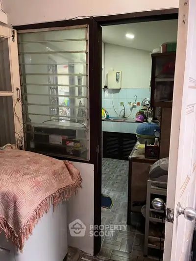 Cozy kitchen with closed layout and modern appliances, perfect for home cooking enthusiasts.