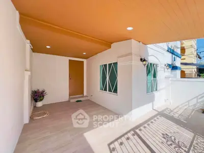 Charming entrance with modern design and ample natural light, perfect for welcoming guests.